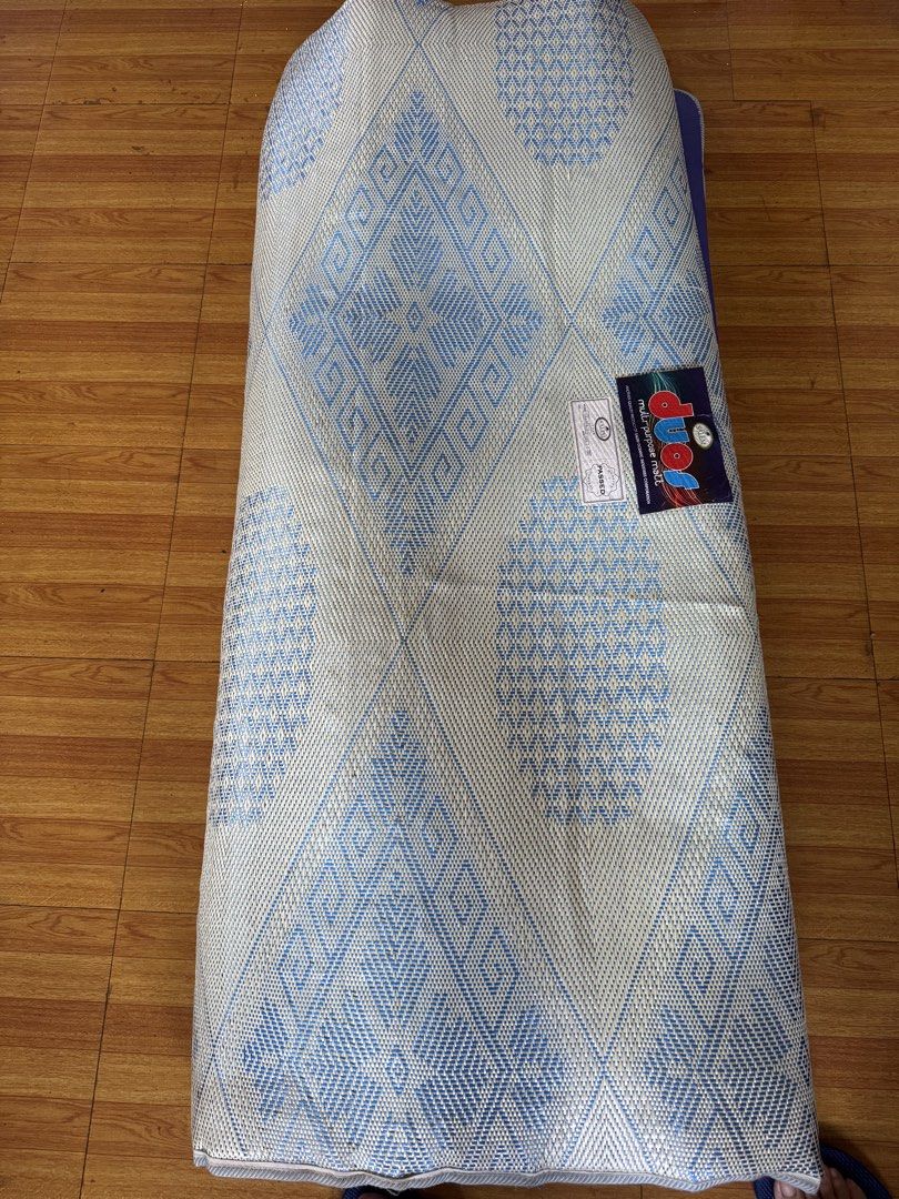 Salem Duo Multi-Purpose Matt (Category: Bed Frames & Mattresses) located in Mandaluyong City. Submitted by winx3 (Listing ID 1468714013, Image 2). Description: - Brand: Salem Duo multi-purpose mattress - Design: Solid purple base with a patterned blue geometric diamond top - Features: Rollable, convenient for extra sleeping space or camping - Condition: Clean surface with piped edges, tag still attached.