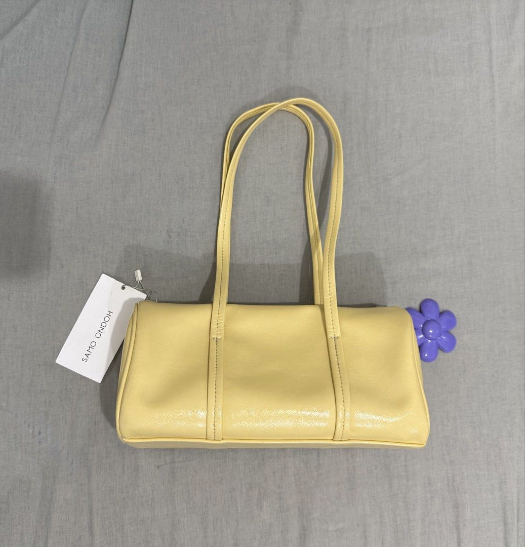 Samo Ondoh Shoulder Bag (Category: Shoulder Bags) located in Makati City. Submitted by vvandko (Listing ID 1468898095, Image 2). Description: Bought directly from SAMO ONDOH Taiwan! 💛 I think the original SRP is around ₱8k–₱9k. The flower chain was bought separately! Super cute bag!! 🌼 Magnetic closure. Comes with its dust bag too! ✨ Negotiable! .