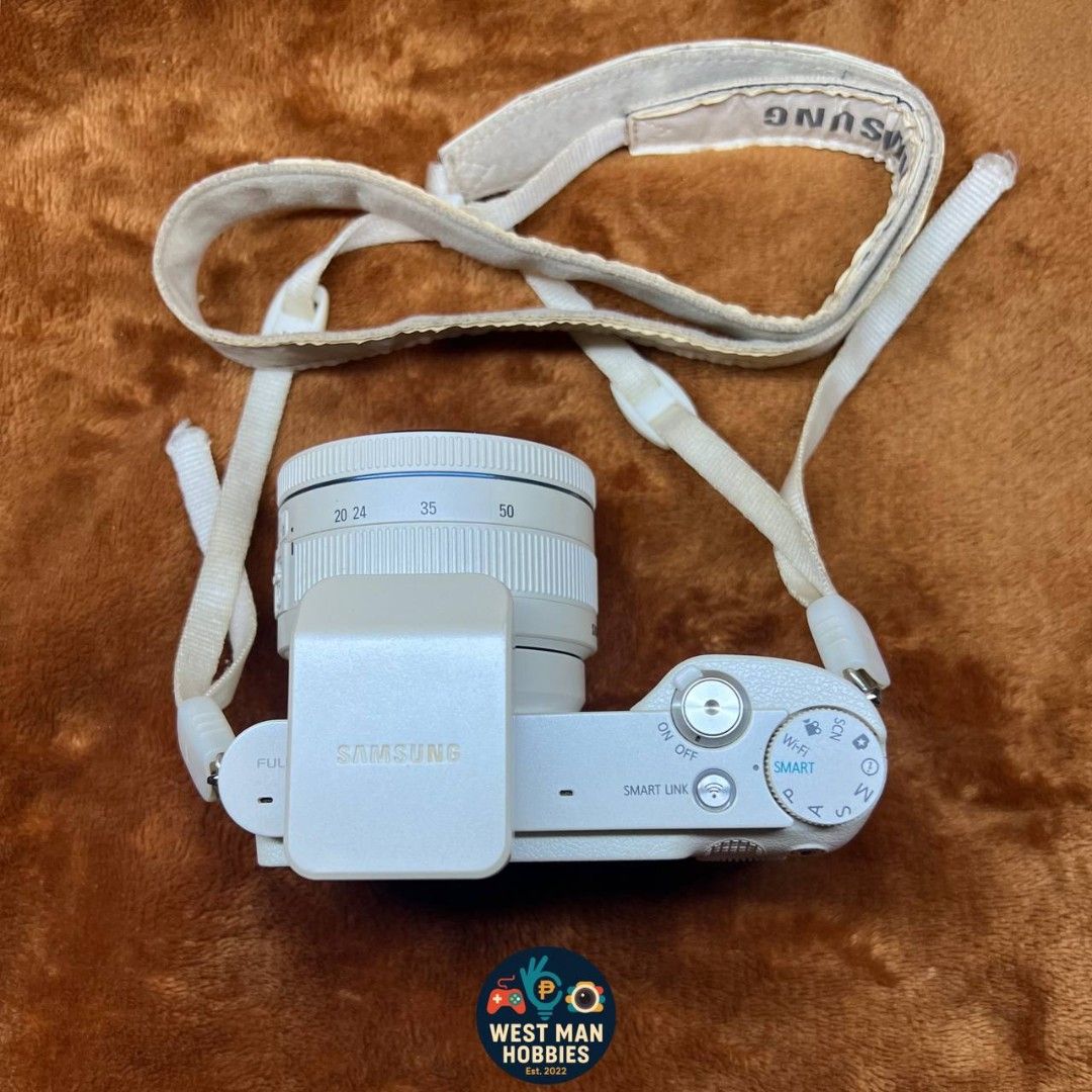Samsung NX1000 camera (Category: Cameras) located in Talavera. Submitted by westmanhobbies-2022 (Listing ID 1468928972, Image 3). Description: Samsung NX1000 budgetmeal mirrorless (Preloved) 20mp 20/50mm lens working af Pop up flash with wifi 9.3/10 body condition (sellers rate) All buttons working Sample shots posted - lens aperture not working hirap mag focus sa madilim, walang problema sa outdoor maganda ang shots! 😊 pwede mo palitan lens or 