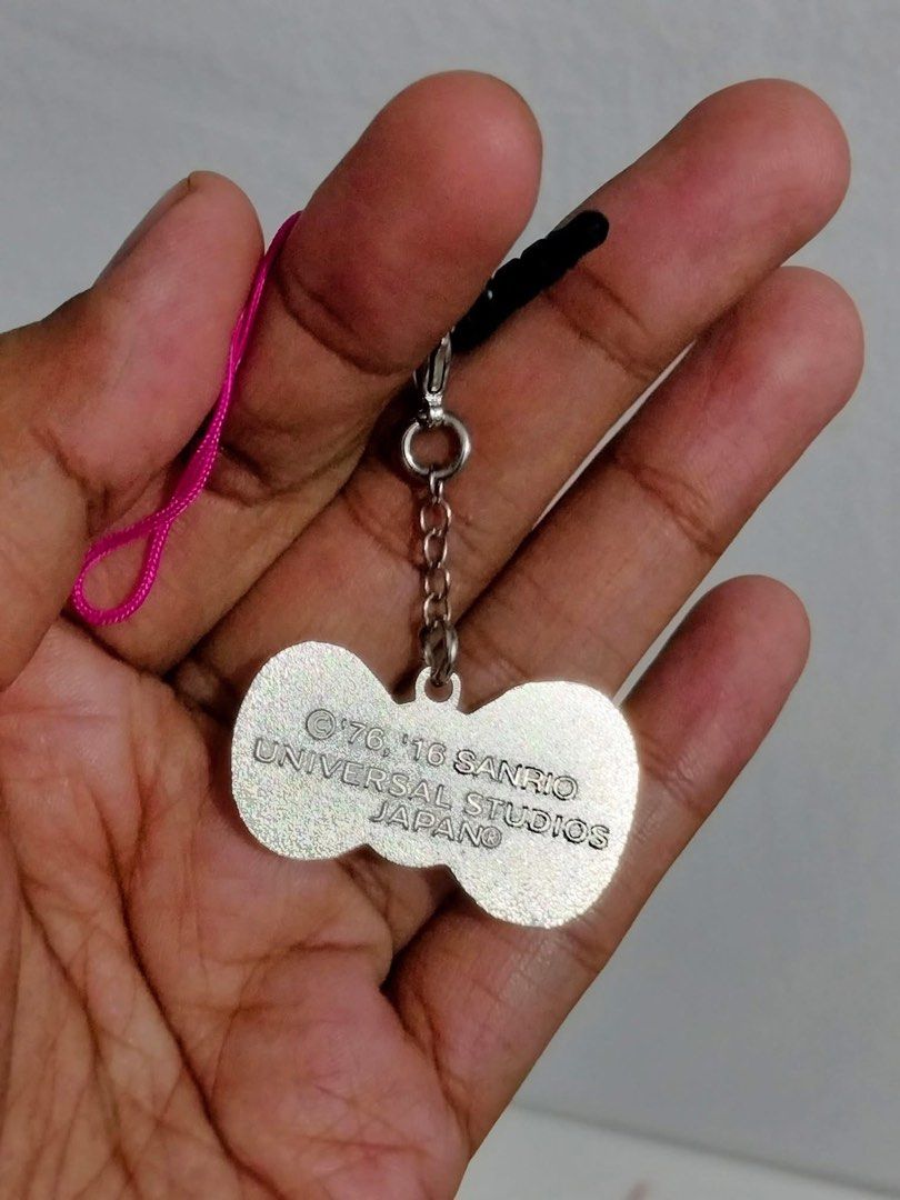 Sanrio Universal Studios Japan Hello Kitty Bow Phone Strap Charm (Category: Character Goods) located in Manila. Submitted by janetecson05 (Listing ID 1468929227, Image 2). Description: - Official Universal Studios Japan Kitty merchandise - Available in 6 different colors (sold individually) - Features a sparkling jeweled center for extra cute sparkle - Includes both a strap loop and a dust plug connector - Collector's item with 1976 and 2016 copy