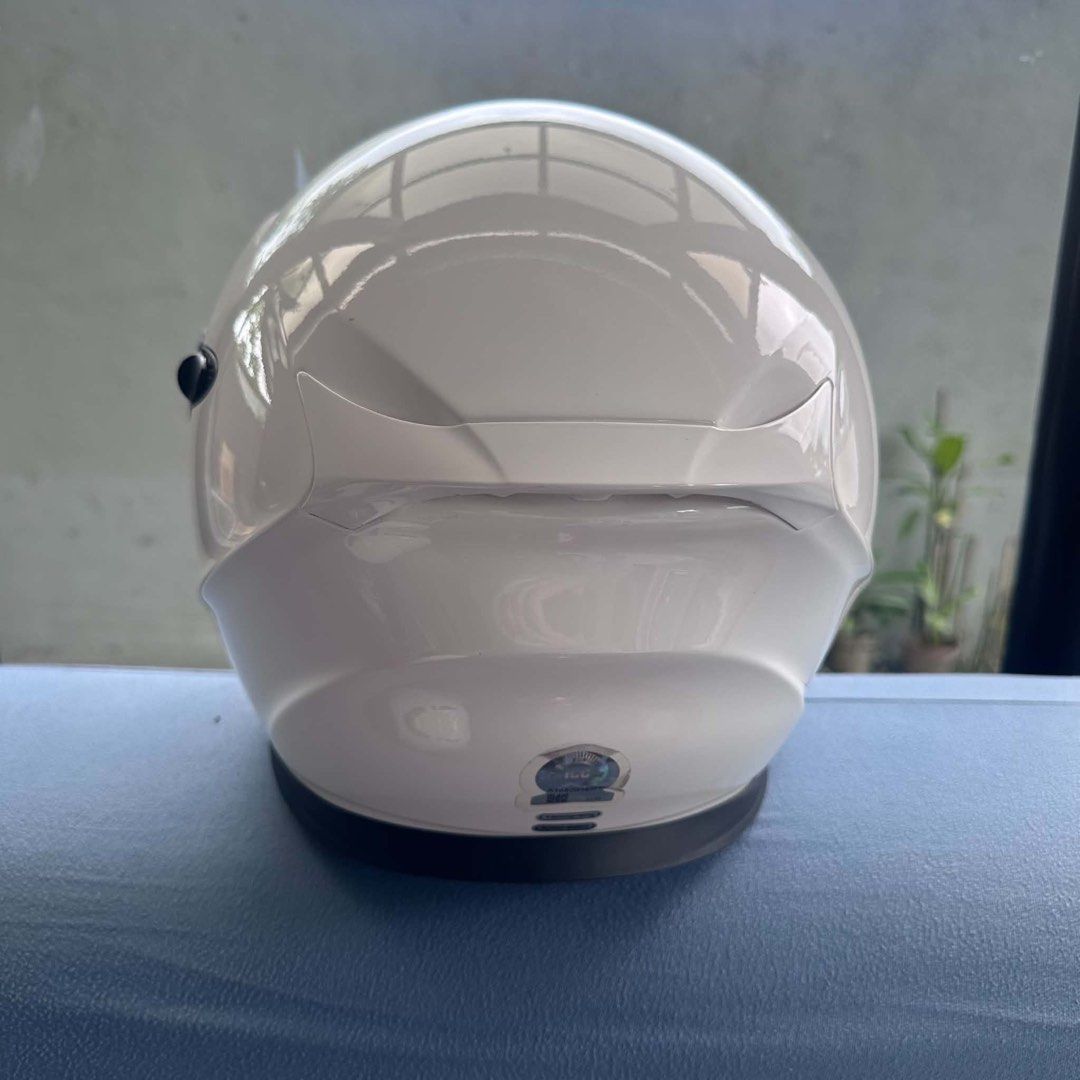 Scorpion EXO modular motorcycle helmet white (Category: Helmets and other Riding Gears) located in Cavite. Submitted by andre.29 (Listing ID 1468742419, Image 3). Description: Solid white modular motorcycle helmet from Scorpion. Flip-up chin bar mechanism works smoothly. Clear main visor plus integrated dark sun visor inside. Top ventilation scoop and front chin vent. Padding inside clean and intact. Clean gloss white finish with minimal signs of