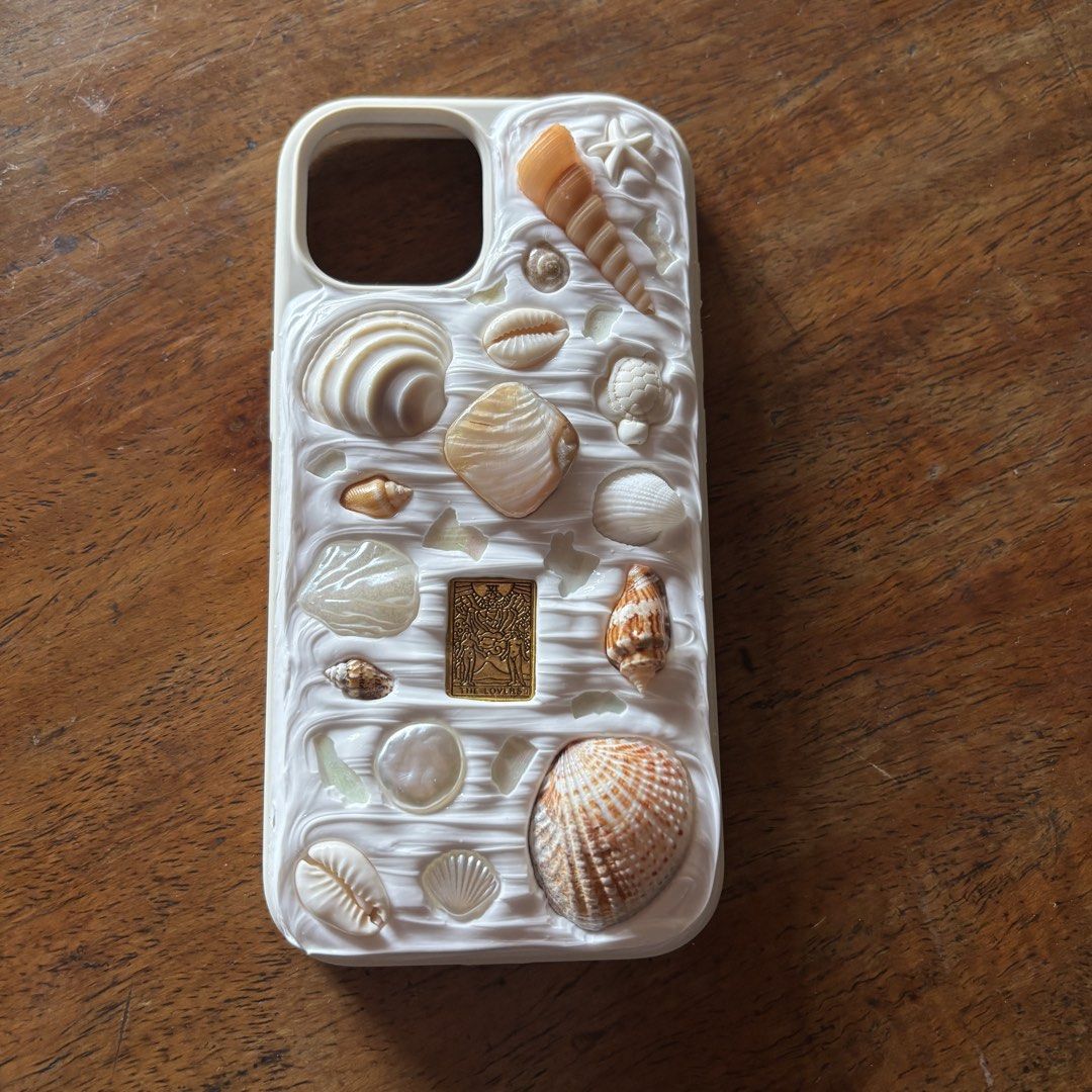 seashell beach iPhone 15 phonecase from iristella__ (Category: Cases & Sleeves) located in Quezon City. Submitted by chescita (Listing ID 1468747954, Image 1). Description: custom made never used cute for beach pics rfs: seller didn’t follow instructions when she designed this for me. not a fan of it *selling for the price I bought it.