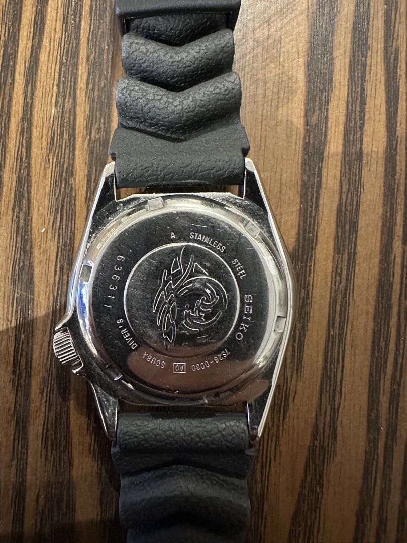 Seiko Automatic Diver's 200m Watch 7S26-0030 (Category: Men's Watches) located in Caloocan City. Submitted by alexandre12 (Listing ID 1468899078, Image 3). Description: - Brand/Model: Seiko Automatic Diver Watch - Dial: Classic black with day-date window at 3 o'clock - Bezel: Smoothly rotating bezel - Lume: Highly luminous hands and hour markers for night visibility - Case & Strap: Stainless steel case paired with a durable black rubber strap and