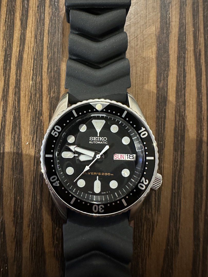 Seiko Automatic Diver's 200m Watch 7S26-0030 (Category: Men's Watches) located in Caloocan City. Submitted by alexandre12 (Listing ID 1468899078, Image 1). Description: - Brand/Model: Seiko Automatic Diver Watch - Dial: Classic black with day-date window at 3 o'clock - Bezel: Smoothly rotating bezel - Lume: Highly luminous hands and hour markers for night visibility - Case & Strap: Stainless steel case paired with a durable black rubber strap and