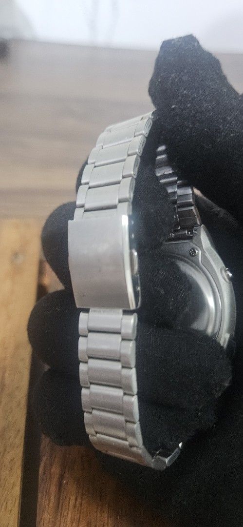Seiko Digital Voice Watch (Category: Men's Watches) located in Santa Maria. Submitted by rommelmateo (Listing ID 1468859616, Image 3). Description: - Brand: Seiko Digital Watch - Design: Unique speaker grille face with silver-tone case and metal link bracelet - Features: Small LCD screen with time/PM indicator and side push buttons - Material: Stainless steel case back - Condition: Normal wear marks from regular use, battery-operated - Rarity: Co