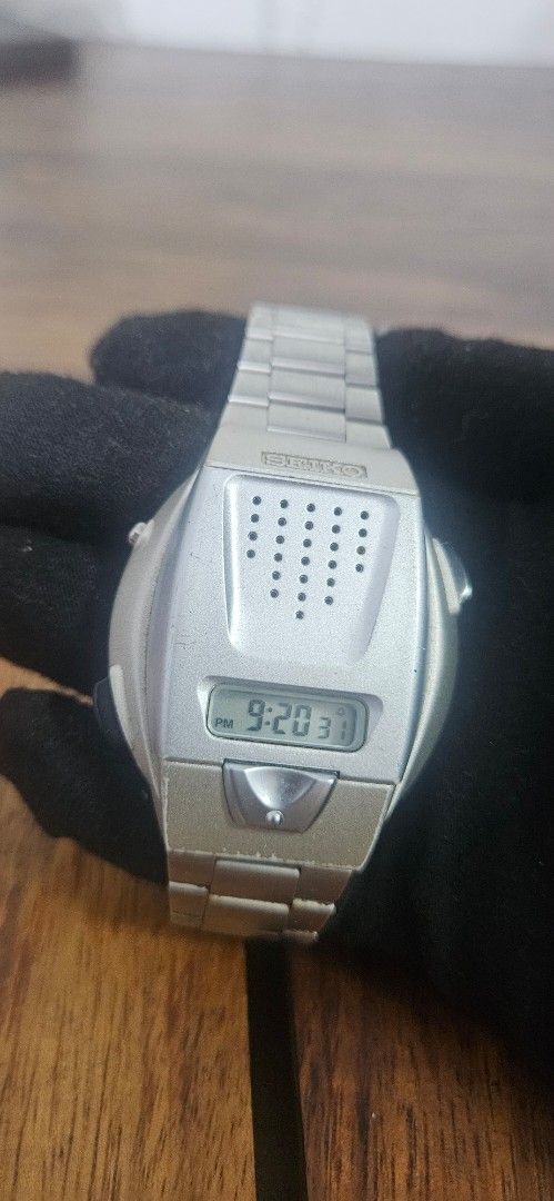 Seiko Digital Voice Watch (Category: Men's Watches) located in Santa Maria. Submitted by rommelmateo (Listing ID 1468859616, Image 1). Description: - Brand: Seiko Digital Watch - Design: Unique speaker grille face with silver-tone case and metal link bracelet - Features: Small LCD screen with time/PM indicator and side push buttons - Material: Stainless steel case back - Condition: Normal wear marks from regular use, battery-operated - Rarity: Co