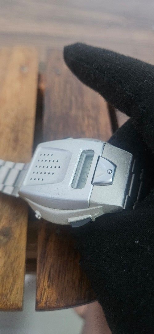 Seiko Digital Voice Watch (Category: Men's Watches) located in Santa Maria. Submitted by rommelmateo (Listing ID 1468859616, Image 2). Description: - Brand: Seiko Digital Watch - Design: Unique speaker grille face with silver-tone case and metal link bracelet - Features: Small LCD screen with time/PM indicator and side push buttons - Material: Stainless steel case back - Condition: Normal wear marks from regular use, battery-operated - Rarity: Co
