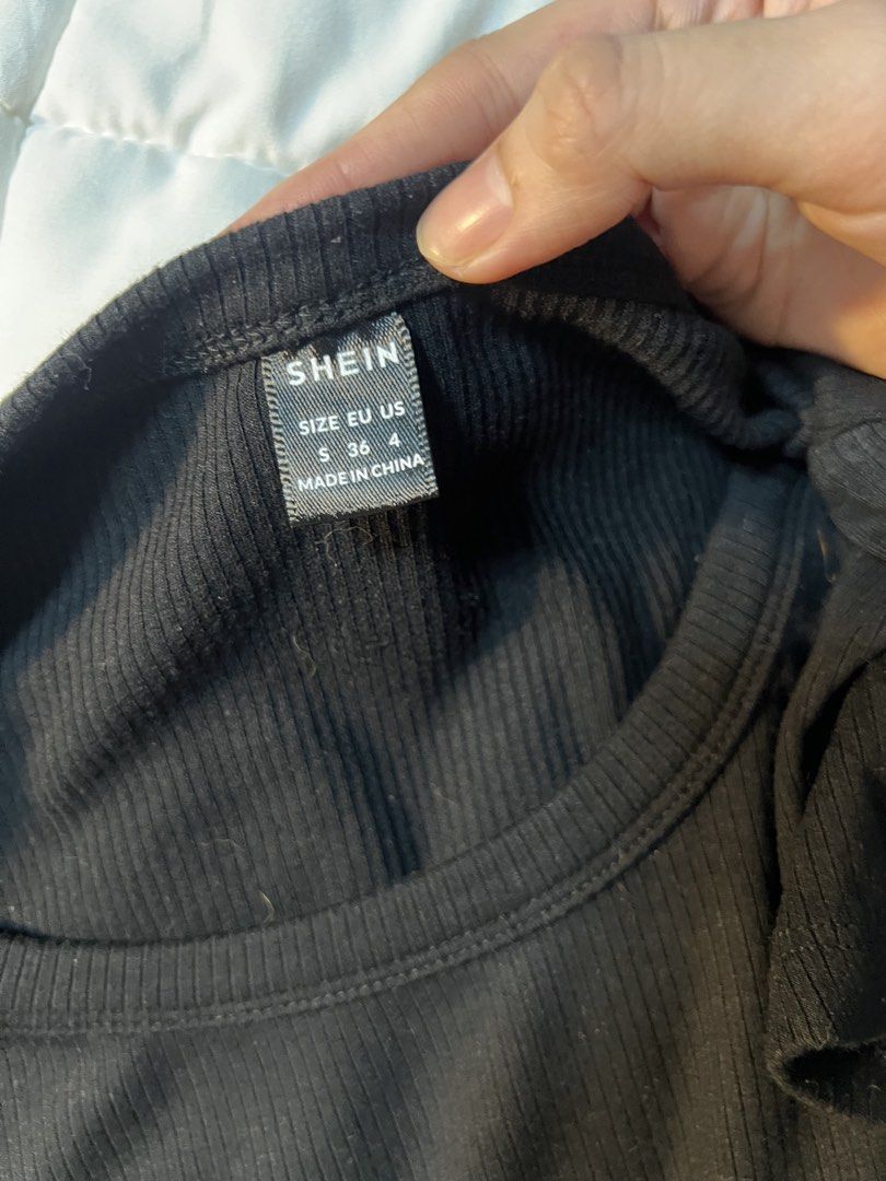 Shein Black Ribbed Crop Top Size S (Category: Sleeveless) located in Marikina City. Submitted by yssacee (Listing ID 1468921844, Image 3). Description: - Brand: Shein - Size: Small - Color: Black - Material: Stretchy ribbed fabric - Design: Short sleeves, scoop neck, and unique pointed front hem - shipping from lower antipolo rizal.