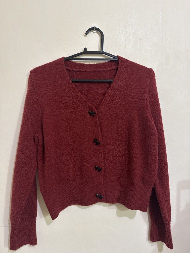 Shein Dazy Red Cardigan (Category: Coats, Jackets and Outerwear) located in Quezon City. Submitted by brandsetcph (Listing ID 1468765256, Image 1). Description: Bought from Shein Dazy brand Size: Large on tag - but best fits Medium (20x22in) Color: Red/Dark Red Snap buttons - bow design Thick material (pefect for cold places) Issue: may himulmol lang. kayo na magtanggal .