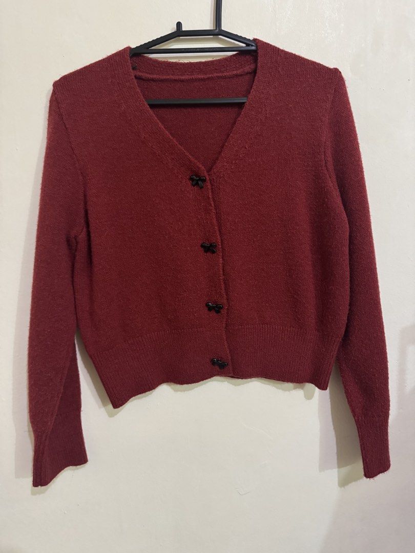 Shein Dazy Red Cardigan (Category: Coats, Jackets and Outerwear) located in Quezon City. Submitted by brandsetcph (Listing ID 1468765256, Image 2). Description: Bought from Shein Dazy brand Size: Large on tag - but best fits Medium (20x22in) Color: Red/Dark Red Snap buttons - bow design Thick material (pefect for cold places) Issue: may himulmol lang. kayo na magtanggal .