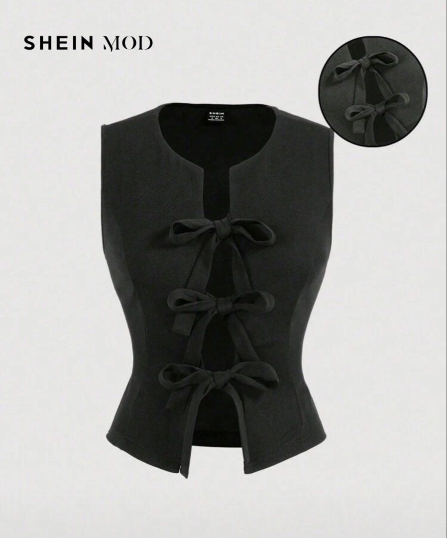 SHEIN MOD Black Bow Front Vest Size S (Category: Sleeveless) located in Quezon City. Submitted by a10as (Listing ID 1468884478, Image 1). Description: - Brand: SHEIN MOD - Style: Black sleeveless vest with fitted silhouette and scoop neckline - Details: Front tie closure with 3 charming bow accents - Size: S (Shoulder: 14", Bust: 34.8", Waist: 27.2", Length: 18.9/17.9") - Fabric: Lightweight and perfect for layering over your favorite tops!.