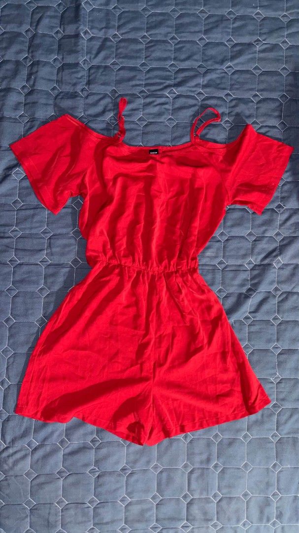 Shein Red Cold Shoulder Romper (Category: Rompers) located in Manila. Submitted by itz_zy (Listing ID 1468847048, Image 1). Description: - Brand: Shein - Color: Bright red - Style: Cold shoulder romper with spaghetti straps and short sleeves - Waist: Elastic for a comfortable, flattering fit - Bottom: Shorts style, easy slip-on - Fabric: Light and breezy, perfect for warm weather - Fit: True to size, great for casual days out.