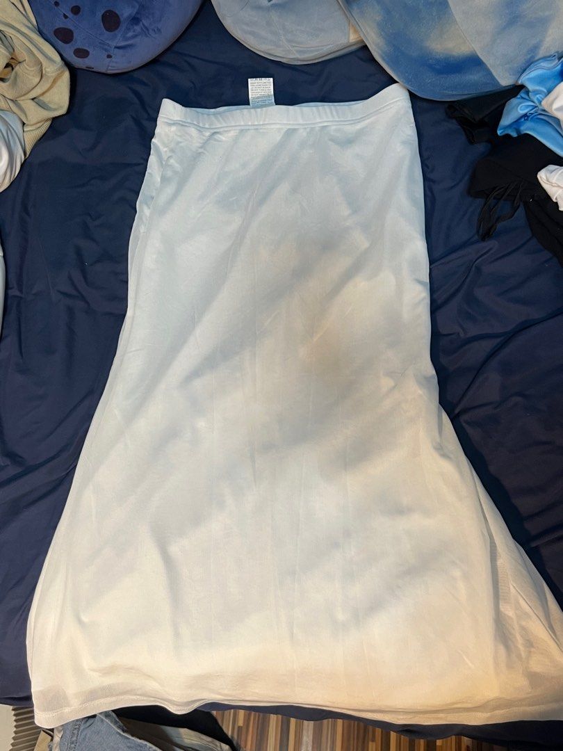 SHEIN White Midi Skirt Size XS (Category: Skirts) located in Marikina City. Submitted by yssacee (Listing ID 1468920910, Image 1). Description: - Brand: SHEIN - Size: XS (US 2) - Material: 95% polyester, 5% elastane (100% polyester lining) - Style: Simple solid color, easy to pair with any top - Condition: Great wardrobe basic - a little transparent, need to wear shorts - shipping from lower antipolo rizal.