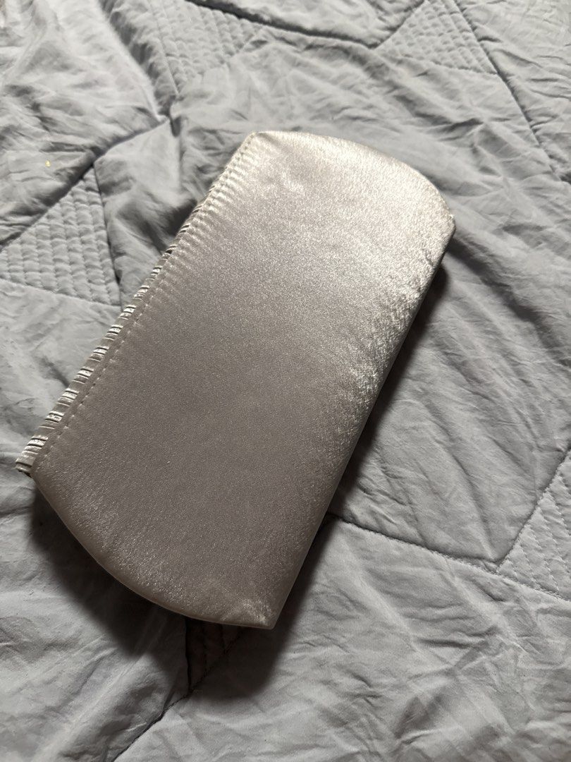Silver Pleated Evening Clutch Bag with Chain Strap (Category: Clutches) located in Caloocan City. Submitted by tootsief (Listing ID 1468864891, Image 2). Description: - Color: Elegant silver - Design: Stylish pleated flap on the front with a smooth satin-like finish on the back - Closure: Secure magnetic snap - Interior: Clean lining with a convenient slip pocket - Strap: Includes a small detachable silver chain strap (still sealed in original pl