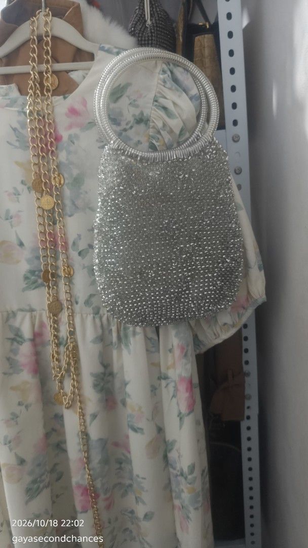 SILVER WIRE BAG (Category: Shoulder Bags) located in Kalibo. Submitted by secondchances.thriftsh8p (Listing ID 1468889699, Image 3). Description: - Color/Finish: Stunning silver with all-over glittering texture - Handles: Sturdy double ring metal handles for easy grip - Design: Small, structured body ideal for parties and evening events - Condition: Clean overall with no loose beads spotted.