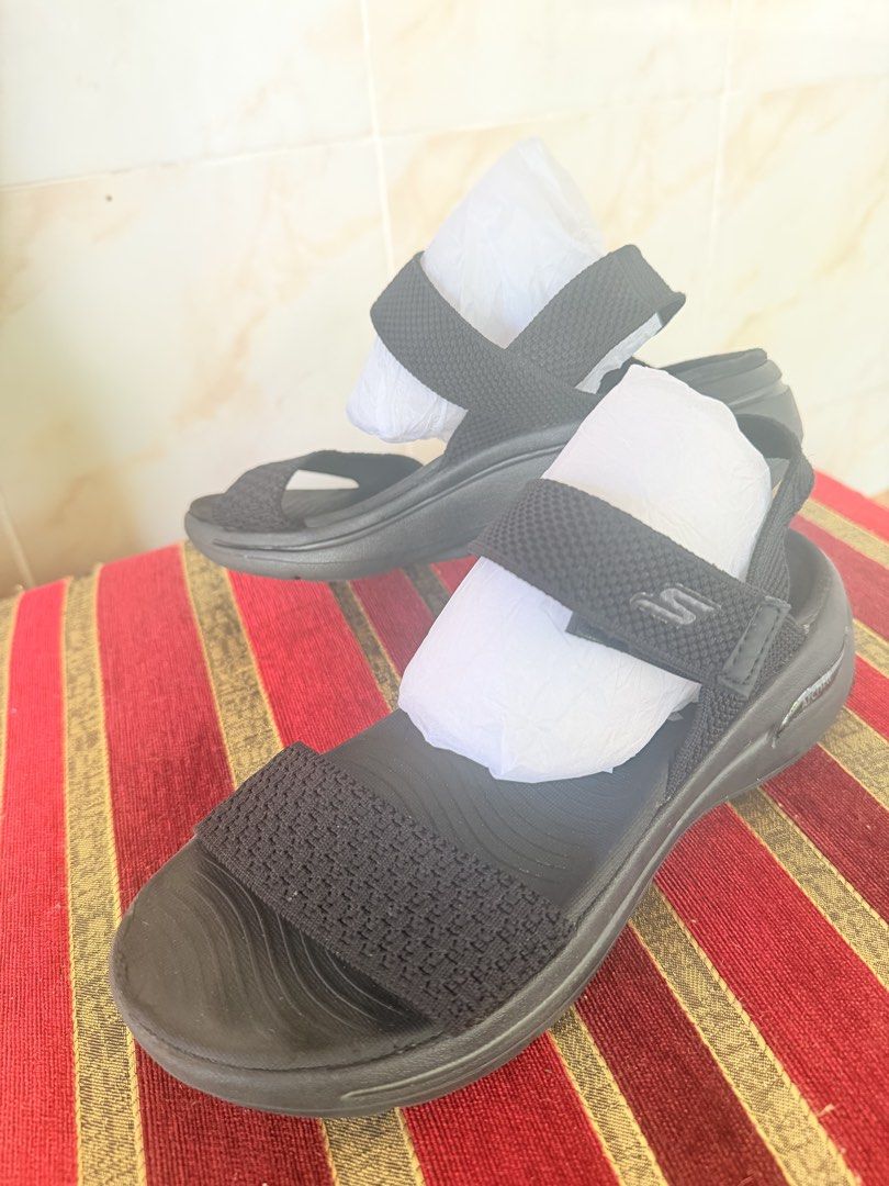 Skechers Arch Fit Black Sandals (Category: Flats & Sandals) located in Manila. Submitted by sedpuprincess (Listing ID 1468786990, Image 2). Description: - Brand: Skechers - Color: Black - Size: (Please message for sizing) - Features: Arch Fit support, contoured footbed for all-day comfort - Closure: Textured forefoot strap and adjustable velcro ankle strap - Condition: Excellent, clean soles and straps, stored with paper stuffing to maintain shap