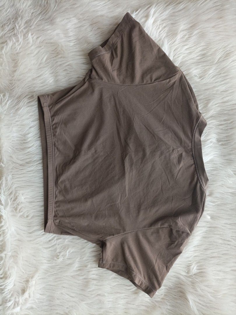SKMS Brown Crop Top Size XS (Category: Sleeveless) located in Pasig City. Submitted by sandacecloset (Listing ID 1468715624, Image 3). Description: - Brand: SKMS - Color: Brown - Size: XS - Style: Short sleeve crop top with a classic round neckline - Material: 76% polyamide, 24% elastane (super soft and stretchy) - Comfort: Tagless design with a printed care label on the inner collar - Condition: Excellent / Like new - Fast shipping and trusted P