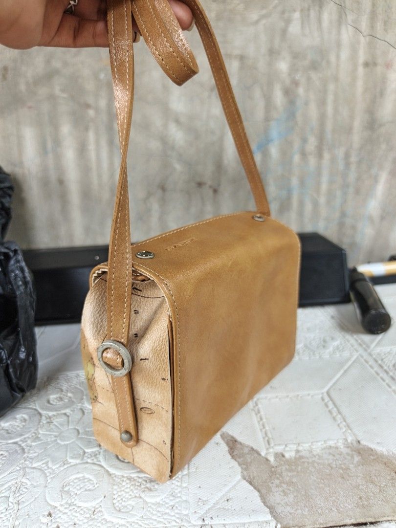 Small sling (Category: Cross-body Bags) located in Quezon, Isabela. Submitted by ukay-ukaybylyn (Listing ID 1468724852, Image 1). Description: small size issue sa last picture may batik-batik need linis pero sa body all goods naman.