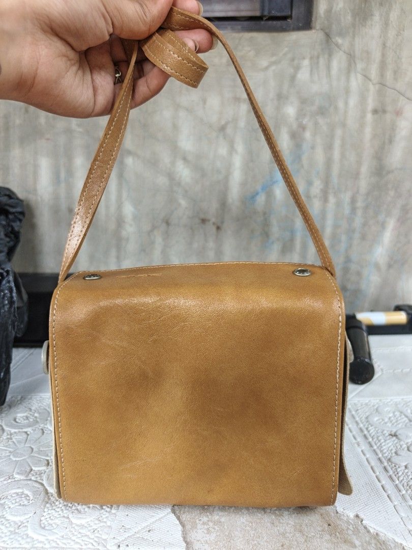 Small sling (Category: Cross-body Bags) located in Quezon, Isabela. Submitted by ukay-ukaybylyn (Listing ID 1468724852, Image 2). Description: small size issue sa last picture may batik-batik need linis pero sa body all goods naman.