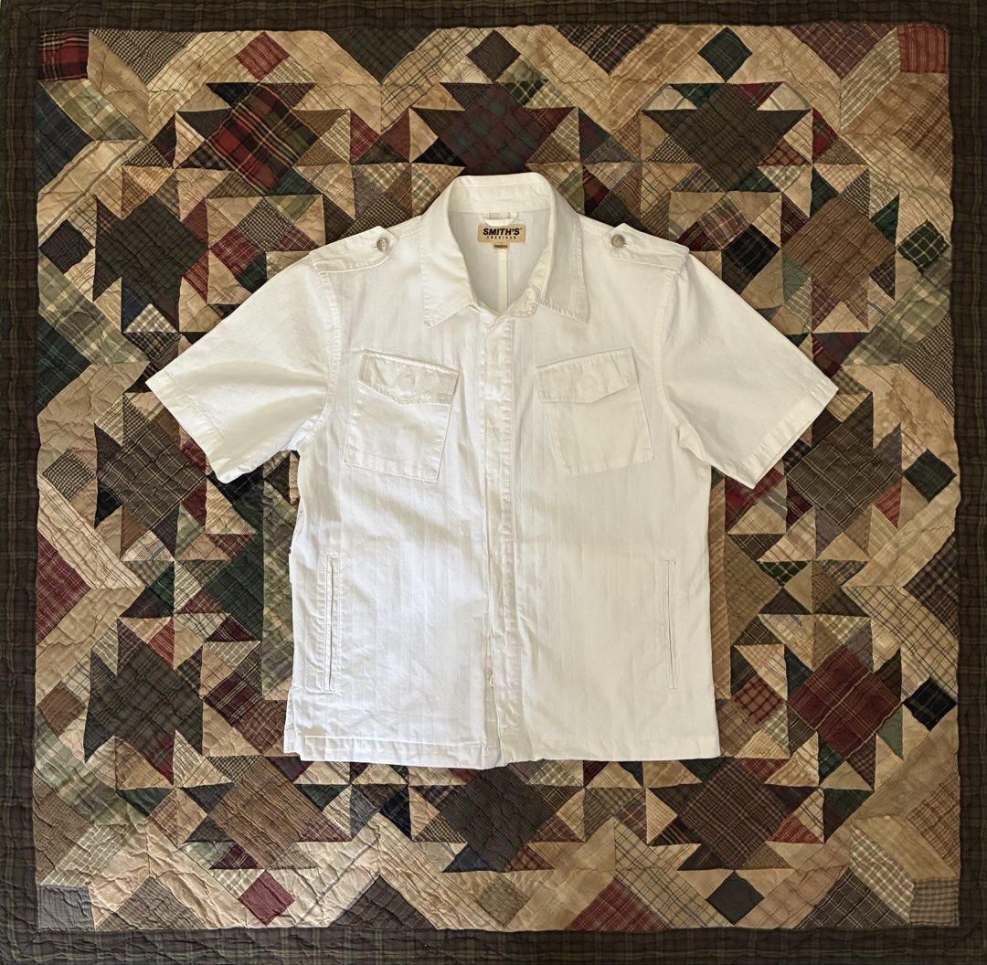 Smith’s HCI Uniform (Category: Tshirts & Polo Shirts ) located in Manila. Submitted by its_ookay.ph (Listing ID 1468736833, Image 1). Description: White button down polo with side pockets, epaulettes and adjusters Tagged M W - 20 L - 25 .