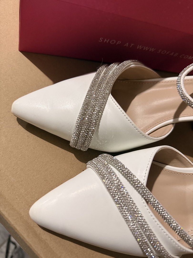 Sofab White Rhinestone Pointed Toe Heels Size 38 (Category: Heels) located in Calamba. Submitted by itszygie (Listing ID 1468734758, Image 2). Description: - Brand: Sofab - Size: 38 - Color: White - Style: Pointed toe heels with stable block heel - Inclusion: Comes with original pink box - Condition: Great for events, weddings, and formal wear - Wear once only.