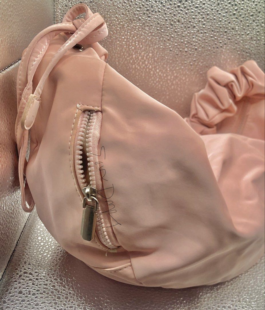 Soft Leather Medium Pastel Pink Hobo Bag (Category: Shoulder Bags) located in Pasig City. Submitted by sourdrops (Listing ID 1468757447, Image 2). Description: - very spacious - shiny leather - adjustable strap (shoulder/kili/bodybag) - has minimal leather cracks - needs cleaning - hardware condition 10/10.