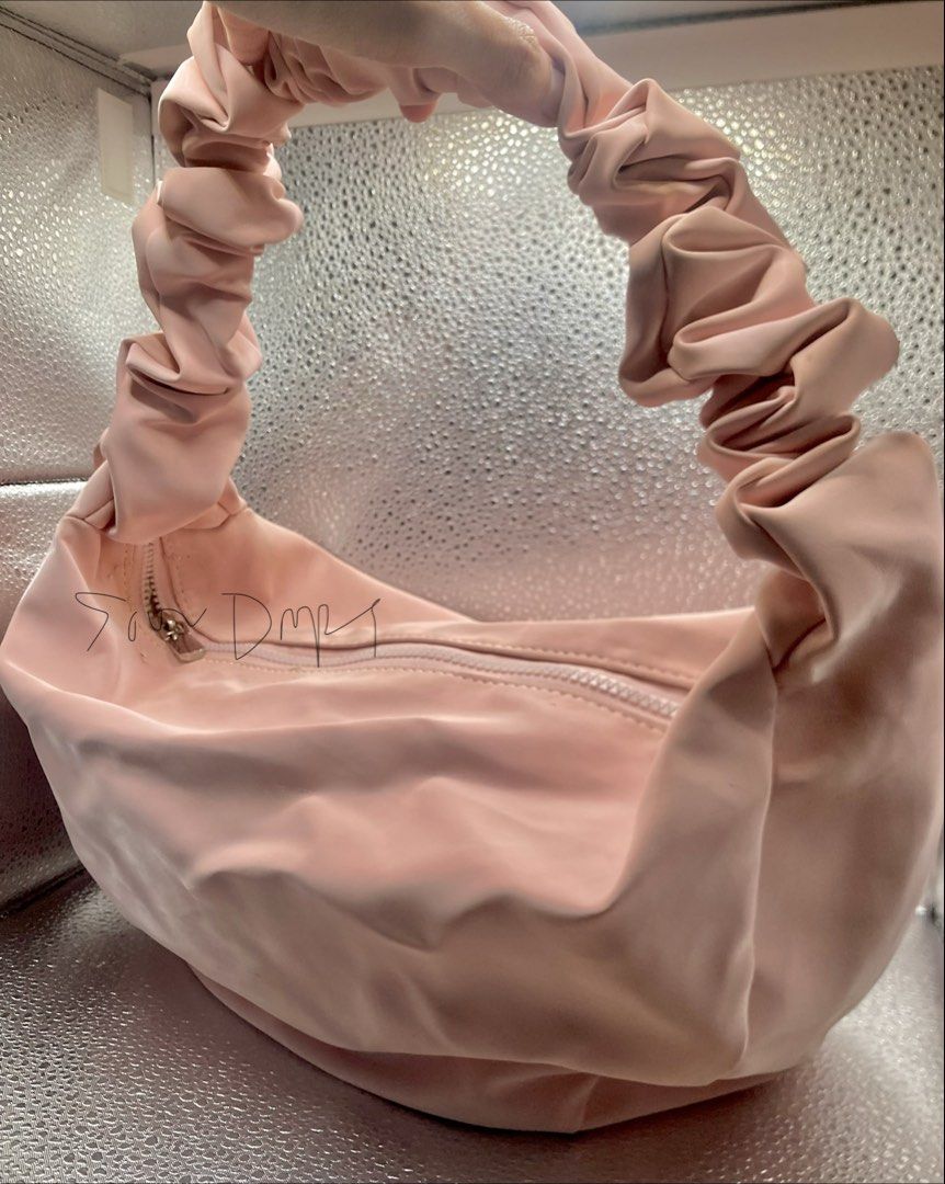 Soft Leather Medium Pastel Pink Hobo Bag (Category: Shoulder Bags) located in Pasig City. Submitted by sourdrops (Listing ID 1468757447, Image 1). Description: - very spacious - shiny leather - adjustable strap (shoulder/kili/bodybag) - has minimal leather cracks - needs cleaning - hardware condition 10/10.