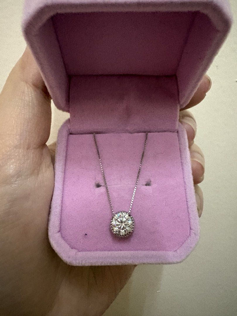 Solitaire Moissanite Pendant Necklace S925 Silver (Category: Necklaces) located in Manila. Submitted by alyannaros79007 (Listing ID 1468898212, Image 3). Description: - Round brilliant-cut solitaire pendant - Delicate silver-tone chain - Secure bezel setting with a beaded rim - Classic, versatile, and perfect for everyday wear - 1 carat Moissanite stone.