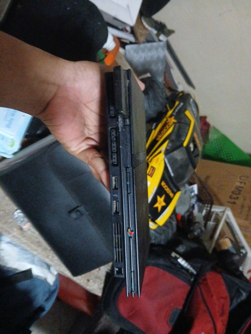 Sony PlayStation 2 Slim Console (Category: PlayStation) located in Manila. Submitted by jakenarvaez0824 (Listing ID 1468849891, Image 1). Description: - Authentic Sony PlayStation 2 Slim console in classic black - Tested and powers on fine, ready for retro gaming - Features front controller ports, memory card slot, and USB ports - Comes with a memory card included in the left slot - Body shows normal scuffs and dust due to storage.