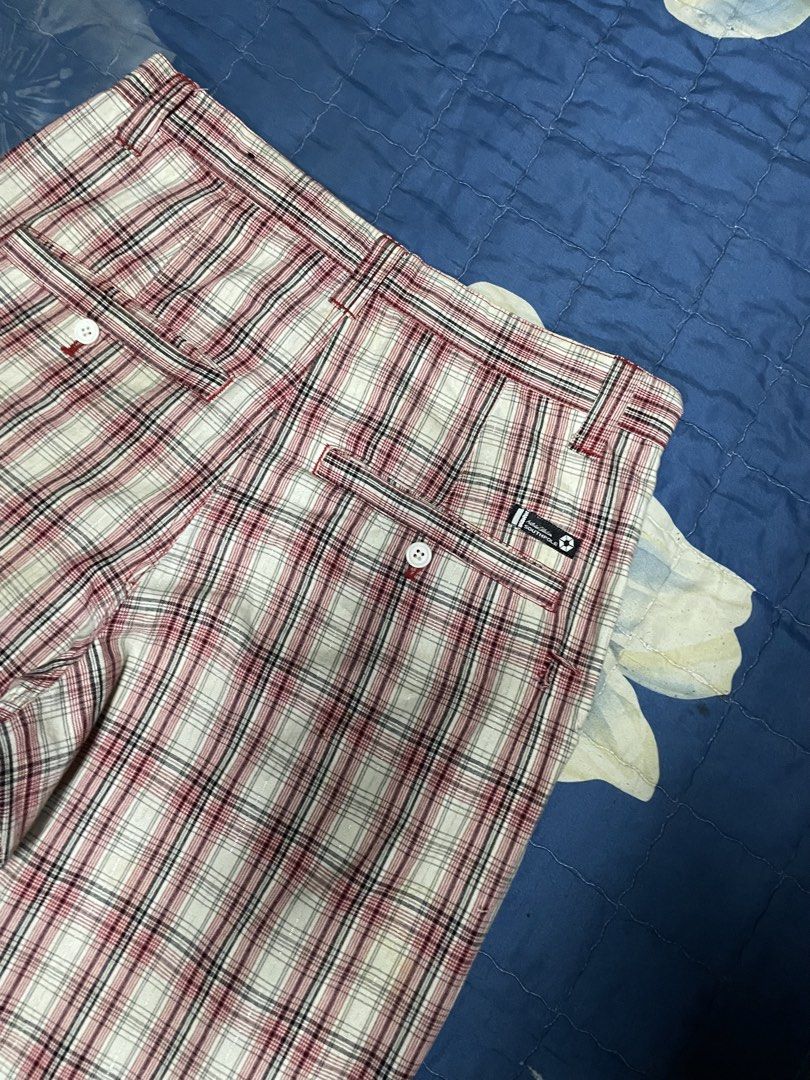 Southpole Red Plaid Shorts (Category: Shorts) located in Manila. Submitted by chawmichael (Listing ID 1468880115, Image 3). Description: - Brand: Southpole - Design: Red, white, and black plaid pattern - Fit: Classic knee-length with belt loops - Pockets: Front slash pockets and button-closure back pockets - Details: Branded label on the inside waistband and back pocket - Material: Comfortable cotton fabric - Style: Casual streetwear.