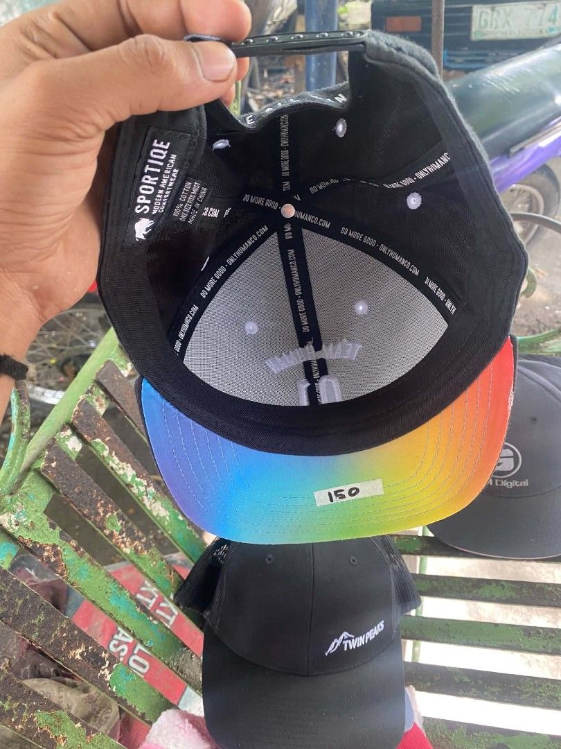 Sportique Team Human 01 Black Snapback Cap (Category: Caps & Hats) located in Sibulan. Submitted by thethiftedcap0728 (Listing ID 1468735016, Image 3). Description: - Brand: Sportique - Color: Black with rainbow holographic under brim - Material: 100% cotton - Front design: 'Team Human 01' embroidery - Back design: 'We all win' text on strap - Closure: Adjustable snapback.