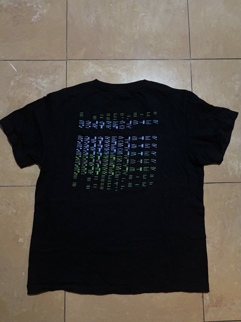 Squarepusher Vortrack JP Promo T-shirt (Category: Tshirts & Polo Shirts ) located in Las Pinas. Submitted by nateb. (Listing ID 1468847397, Image 2). Description: - Color: Black - Design: Blue and green pixelated cyber graphic on chest with large digital matrix print on the back - Fit: Regular fit, comfortable cotton fabric - Measurements: ~25 inches length, ~20 inches armpit to armpit - Condition: Clean, well-maintained pre-loved item.