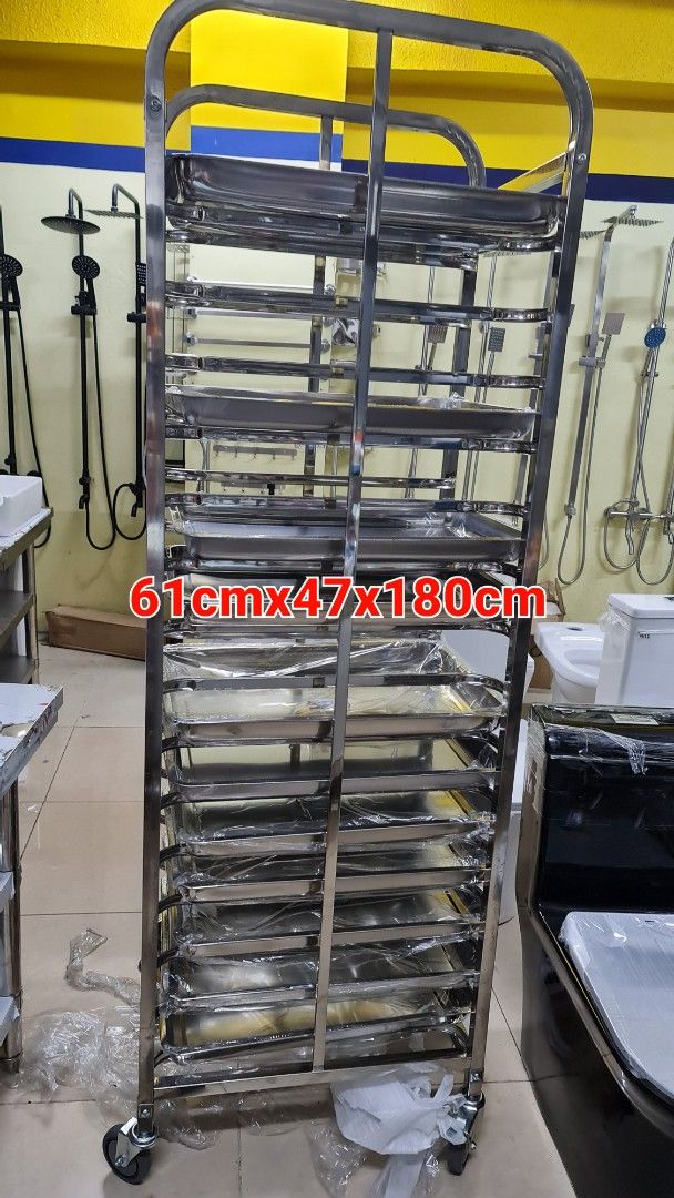 Stainless Steel Multi-Tier Tray Cart Storage Rack (Category: Shelves, Cabinets & Racks) located in Manila. Submitted by oddcrystal_66a000 (Listing ID 1468822085, Image 2). Description: - Heavy-duty stainless steel construction built to last - Dimensions: 61cm (L) x 47cm (W) x 180cm (H) - Includes multiple removable trays (protective plastic wrap still on parts) - Equipped with smooth caster wheels for effortless mobility - Sturdy frame securely h
