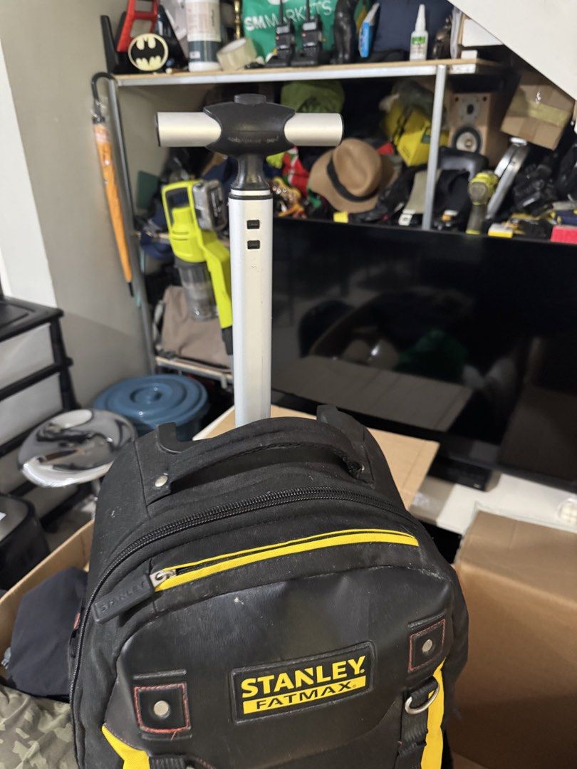Stanley FatMax Wheeled Tool Backpack (Category: Backpacks) located in Cavite. Submitted by marcuz1316 (Listing ID 1468927207, Image 3). Description: Heavy-duty tool backpack from Stanley FatMax. Black and yellow heavy fabric construction. Telescoping handle pulls out from the top so you can roll it around easily. Lots of pockets, loops, and mesh storage spaces for gear and tools. Strong zippers with rubber pulls. Used condition with some dust and