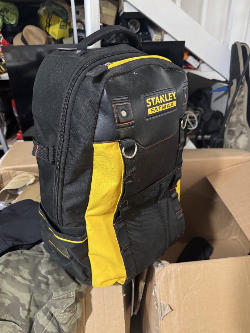 Stanley FatMax Wheeled Tool Backpack (Category: Backpacks) located in Cavite. Submitted by marcuz1316 (Listing ID 1468927207, Image 2). Description: Heavy-duty tool backpack from Stanley FatMax. Black and yellow heavy fabric construction. Telescoping handle pulls out from the top so you can roll it around easily. Lots of pockets, loops, and mesh storage spaces for gear and tools. Strong zippers with rubber pulls. Used condition with some dust and