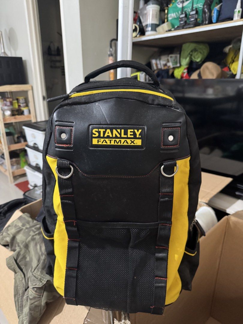 Stanley FatMax Wheeled Tool Backpack (Category: Backpacks) located in Cavite. Submitted by marcuz1316 (Listing ID 1468927207, Image 1). Description: Heavy-duty tool backpack from Stanley FatMax. Black and yellow heavy fabric construction. Telescoping handle pulls out from the top so you can roll it around easily. Lots of pockets, loops, and mesh storage spaces for gear and tools. Strong zippers with rubber pulls. Used condition with some dust and