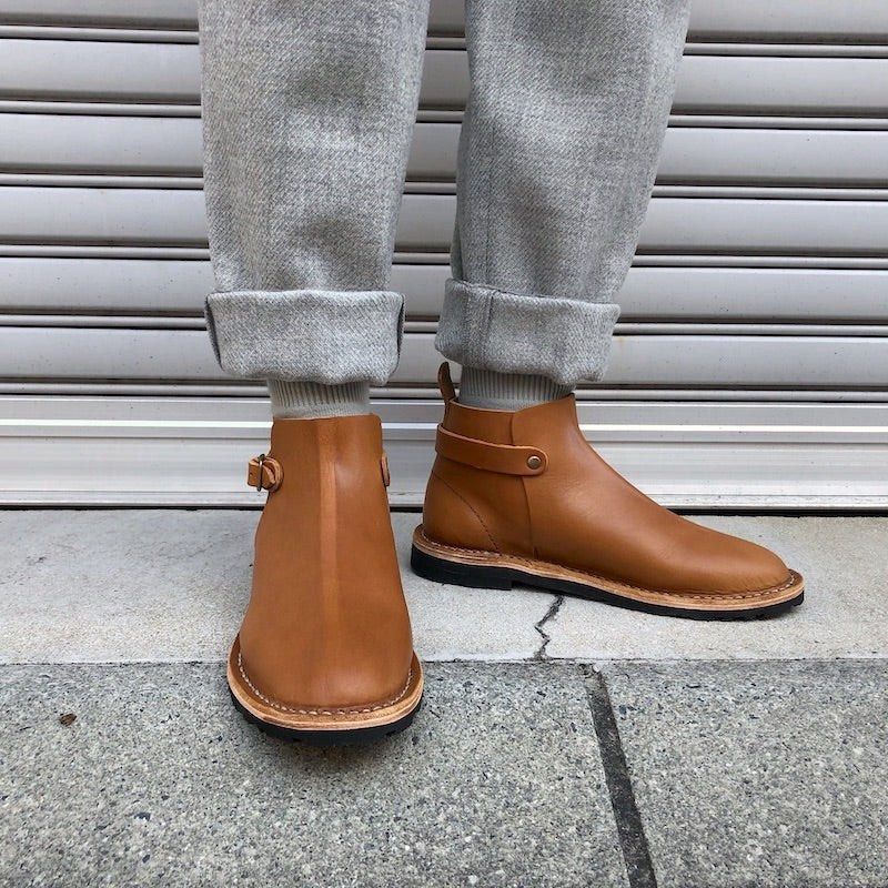 Steve Mono 10/14 Artisanal Boots (Cognac) (Category: Boots) located in Quezon City. Submitted by jswinton (Listing ID 1468760352, Image 3). Description: Steve Mono 10/14 Artisanal Boots (Cognac)The Build: Handcrafted in Spain from ultra-premium, supple Tuscan calfskin leather. A masterclass in European minimalism, featuring a seamless high-ankle shaft and a clean, high-set collar strap with a solid brass buckle. The Comfort: Fitted with Steve Mon