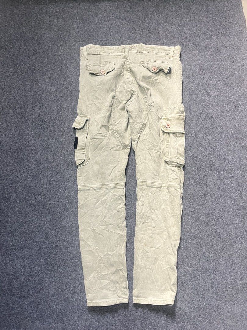 Stone island cargo pants (Category: Jeans) located in Lapu Lapu. Submitted by jhonrener41426 (Listing ID 1468930094, Image 2). Description: Size 30 Thigh-10 Length-38 Leg opening-6 Excellent condition Color rate 9.8/10 Complete tags Issue none .