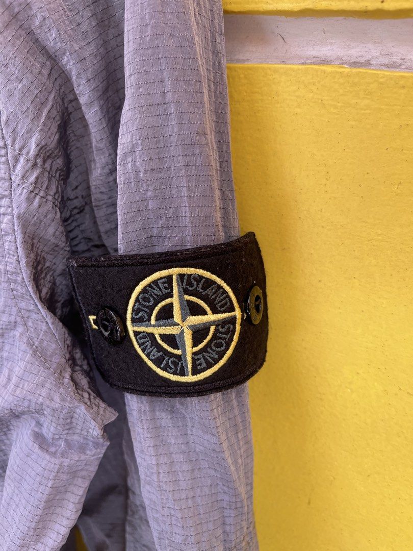 Stone Island Grid Check Zip Jacket Grey Size M (Category: Coats, Jackets and Outerwear) located in Baguio. Submitted by yuno.cartel (Listing ID 1468728341, Image 3). Description: - Authentic Stone Island jacket in grey - Unique grid pattern texture throughout - Size: Large fitting - Full zip closure with collar - Dual chest flap pockets - Signature compass patch badge on left sleeve - Verified genuine via interior Certilogo tag - Condition: Excel