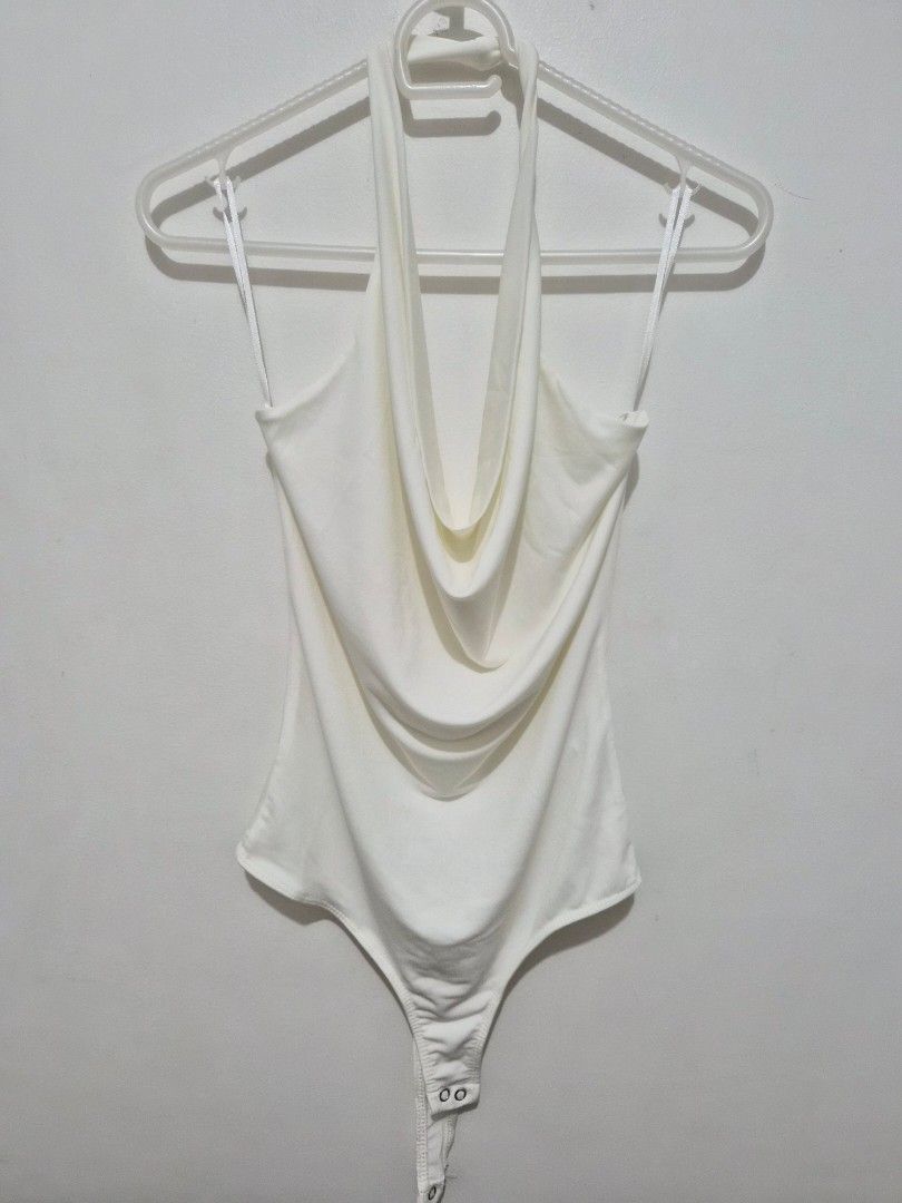 Stradivarius White Cowl Neck Bodysuit Size M (Category: Sleeveless) located in Mandaluyong City. Submitted by joyce1593 (Listing ID 1468818492, Image 1). Description: - Brand: Stradivarius - Item: Cowl neck bodysuit - Color: White - Size: M (EUR M, USA M, MEX 28) - Origin: Made in Turkey - Design: Sleeveless with thin straps and bottom snap button closure - Styling: Perfect basic piece for layering or wearing on its own.