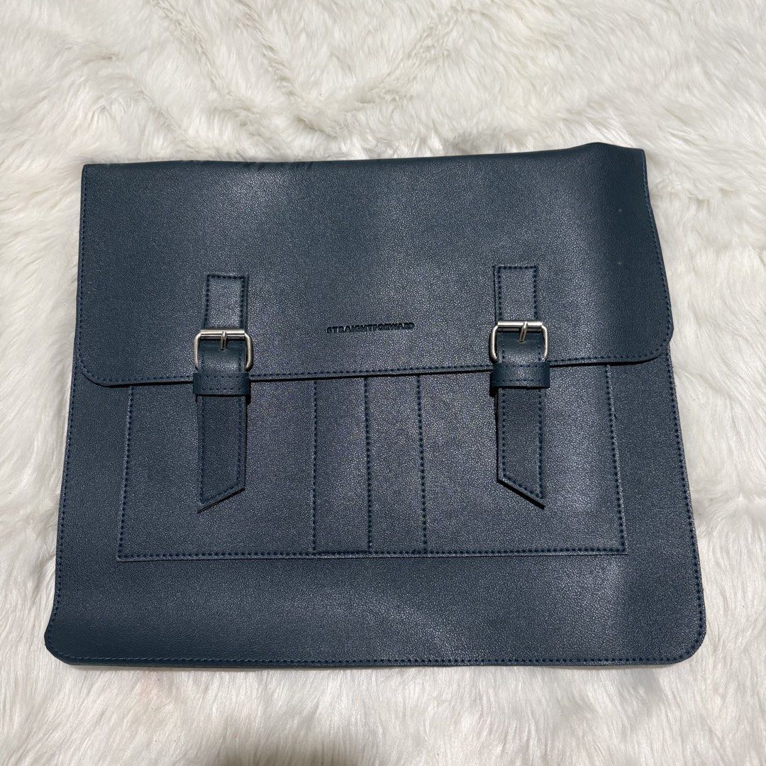 Straightforward Dark Green Document Bag Laptop Sleeve Folder (Category: Laptop Bags & Sleeves) located in Pasig City. Submitted by mommy_n_me_closet (Listing ID 1468793931, Image 1). Description: - Color & Material: Dark green vegan leather - Closure: Secure buckle closures on the front flap - Storage: Convenient front pocket design with vertical stitching - Style: Clean structure with a minimalist aesthetic and stamped brand logo - Best for: Dai