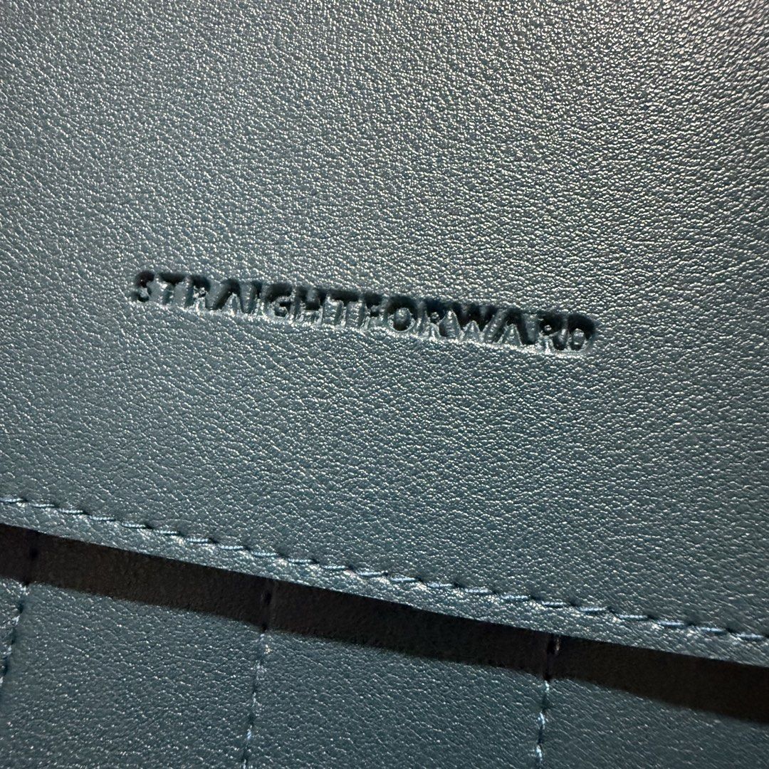Straightforward Dark Green Document Bag Laptop Sleeve Folder (Category: Laptop Bags & Sleeves) located in Pasig City. Submitted by mommy_n_me_closet (Listing ID 1468793931, Image 2). Description: - Color & Material: Dark green vegan leather - Closure: Secure buckle closures on the front flap - Storage: Convenient front pocket design with vertical stitching - Style: Clean structure with a minimalist aesthetic and stamped brand logo - Best for: Dai