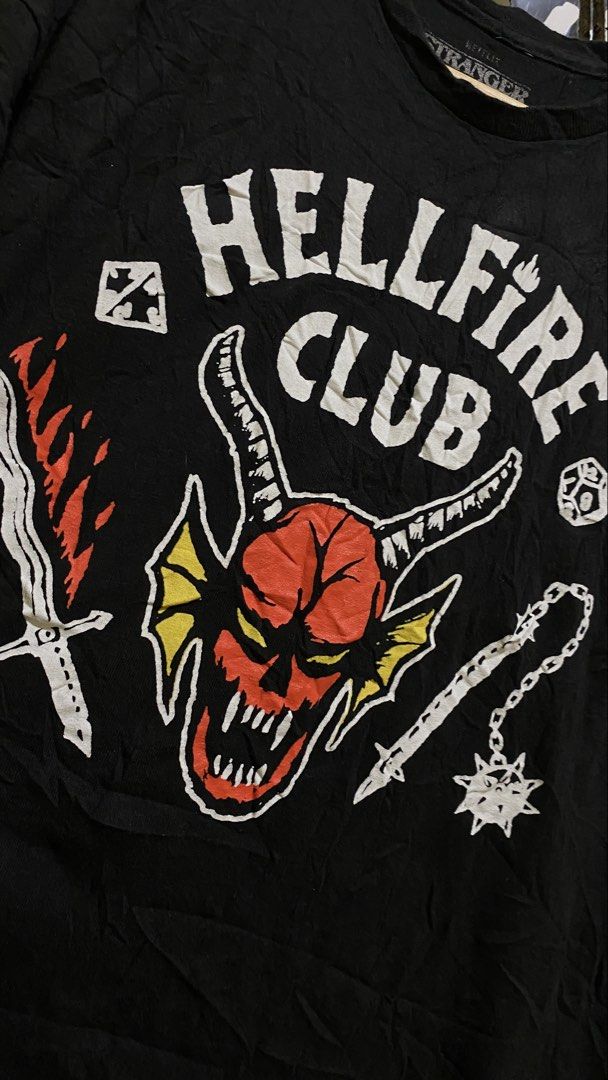 Stranger Things Hellfire Club (Category: Tshirts & Polo Shirts ) located in Tacurong. Submitted by styledtwice1999 (Listing ID 1468842384, Image 2). Description: Hellfire Club Stranger things 🔥 Medium To Large Fittings Condition : 10/10🔥 Dm for more closer shots and Actual Dimes💎.