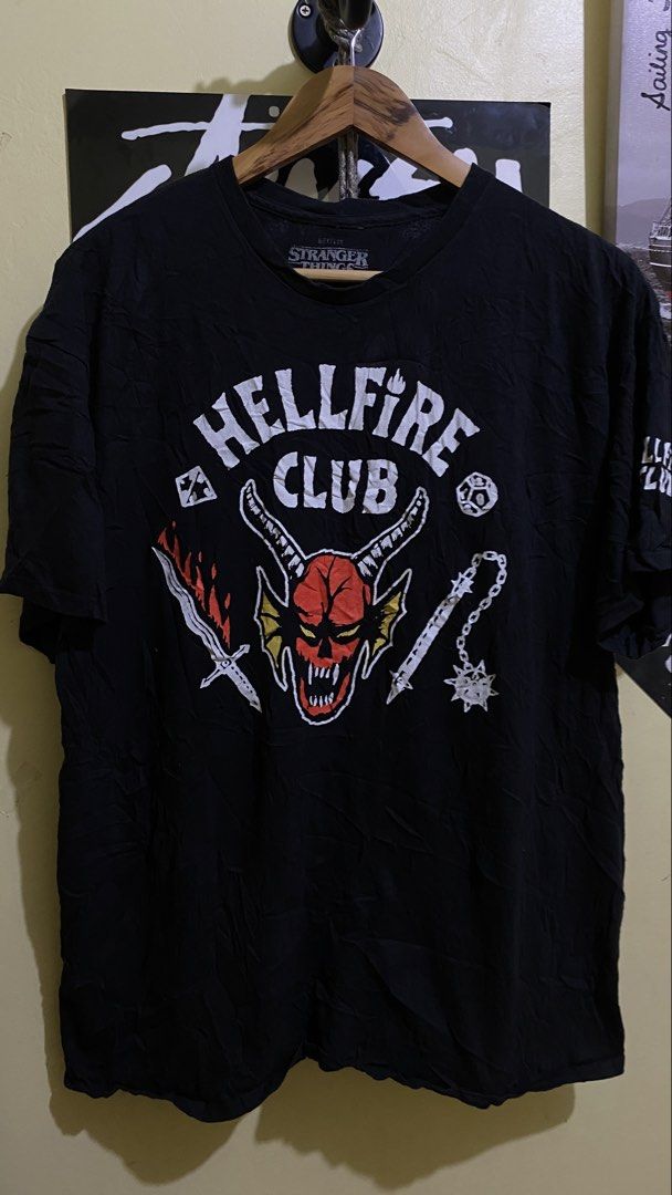 Stranger Things Hellfire Club (Category: Tshirts & Polo Shirts ) located in Tacurong. Submitted by styledtwice1999 (Listing ID 1468842384, Image 1). Description: Hellfire Club Stranger things 🔥 Medium To Large Fittings Condition : 10/10🔥 Dm for more closer shots and Actual Dimes💎.