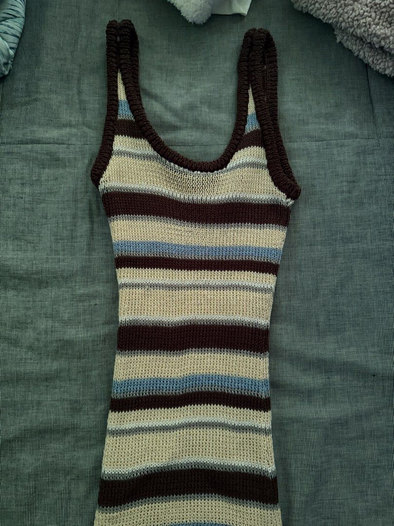 Striped Knit Midi Dress (Category: Dresses) located in Manila. Submitted by jaehyun2829 (Listing ID 1468735127, Image 2). Description: - Style: Striped knit midi dress - Colorway: Brown, cream, and blue tones - Neckline: Scoop neck with thick ribbing along straps and collar - Fit: Fitted silhouette with stretchy knit fabric for comfort - Versatility: Great for casual everyday wear or stylish layering.