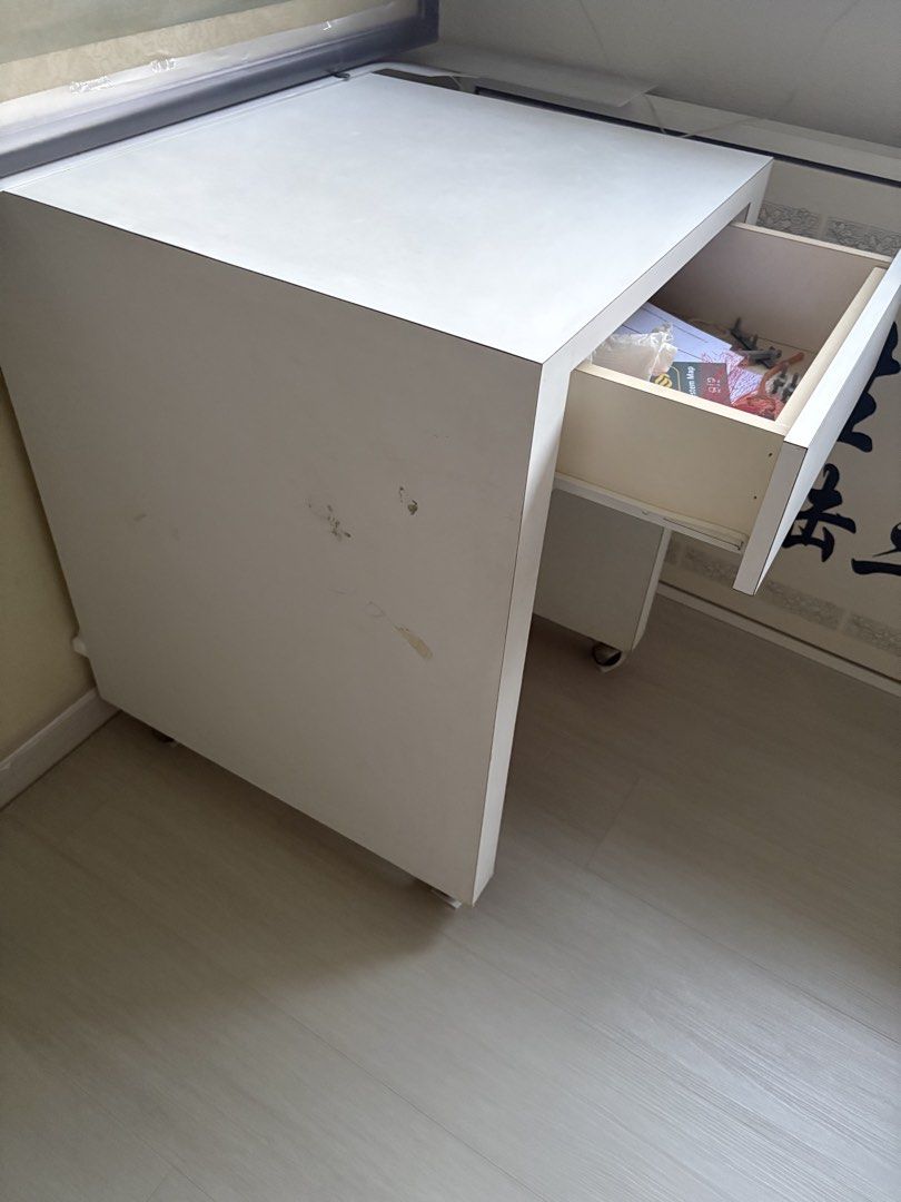 Study table (Category: Tables & Sets) located in Singapore. Submitted by baseinsg (Listing ID 1468806918, Image 3). Description: Selling a good condition study table. Solid wood material with 1 drawer. 1. Table dimension LxWxH: 56cm x 60cm 76cm. Collect at Blk 253, Bishan ST 22, Postal 570253..