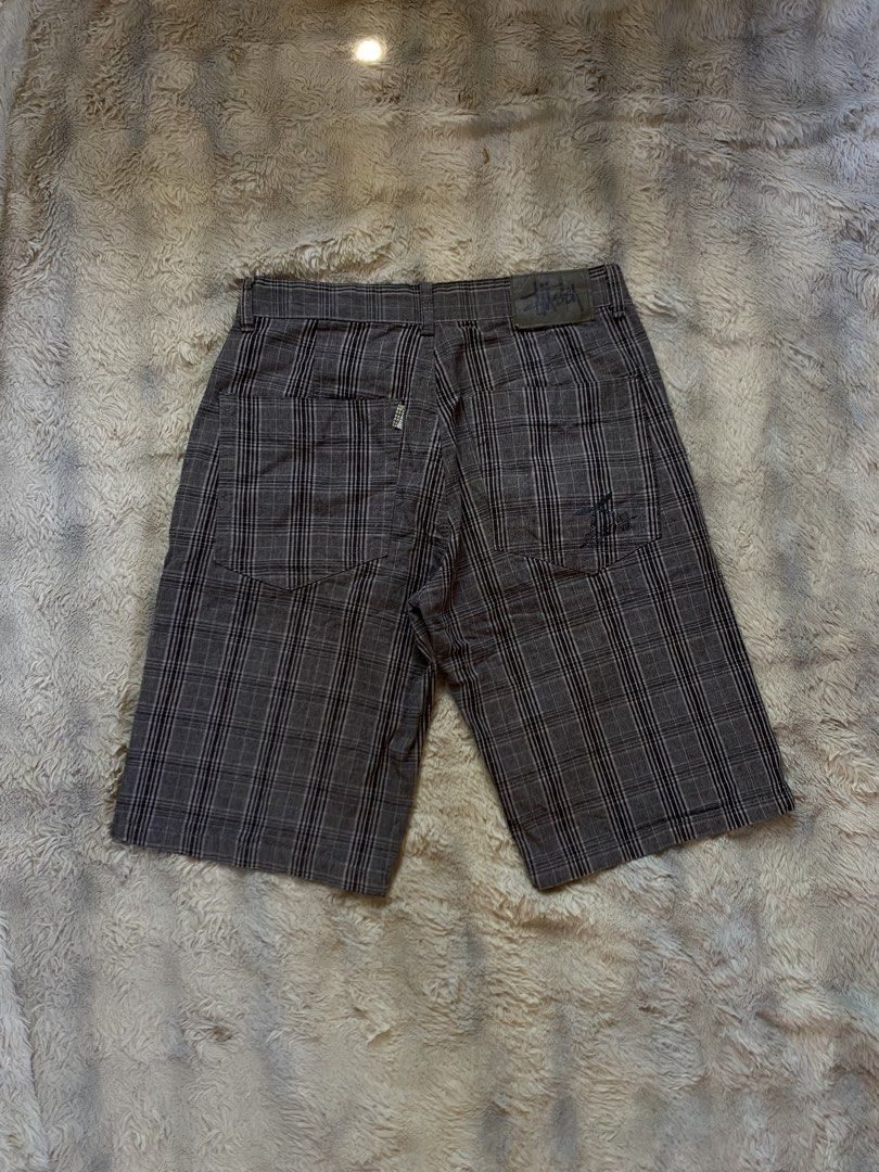 Stussy Plaid Shorts Grey Black (Category: Shorts) located in Andop. Submitted by safewater-895a (Listing ID 1468727547, Image 1). Description: - Brand: Stussy - Style: Plaid shorts in grey and black check pattern - Details: Leather waist patch on the back, signature woven tag - Accents: Embroidered graphic hit near the right rear pocket - Features: Built-in belt loops - Condition: Great piece for streetwear fits.
