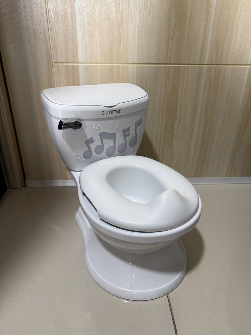 Summer My Size Potty Lights & Songs (Category: Toilet Training) located in Taguig. Submitted by dmtkph (Listing ID 1468733719, Image 2). Description: - Summer My Size Potty Lights & Songs training system in white - Realistic toddler toilet design that encourages potty training - Features interactive lights and plays 3 different songs - Comes with a built-in wipe compartment for convenience - Super clean and ready for use.