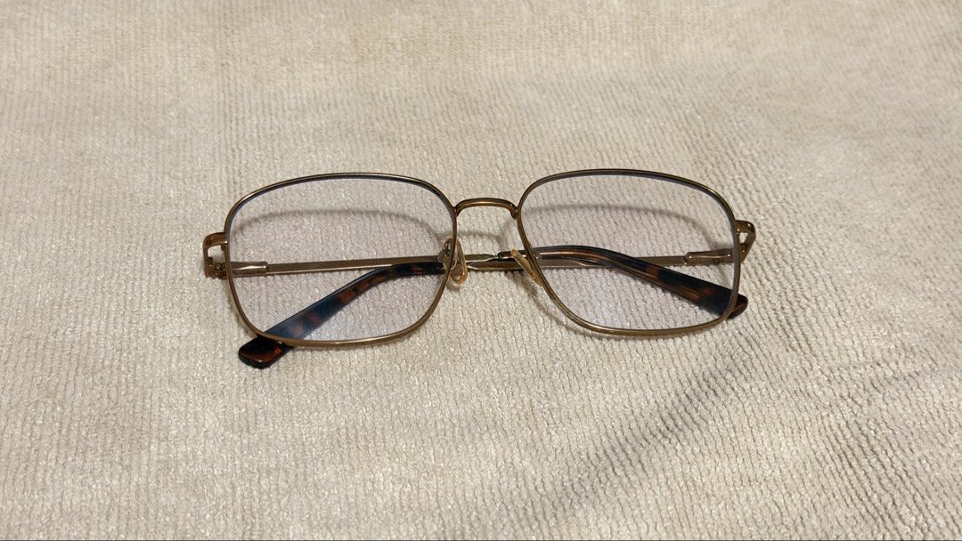SUNNIES ANTI RAD GLASSES (Category: Sunglasses & Eyewear) located in General Santos City (Dadiangas). Submitted by ccaburog (Listing ID 1468884040, Image 1). Description: - Frame: Gold-tone metal in a trendy square silhouette - Details: Tortoiseshell acetate temple tips and clear lenses - Fit: Lightweight everyday style, standard adult sizing - Condition: Adjustable nose pads show minor discoloration due to age INCLUSION: Box.