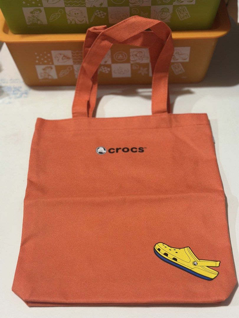 Suntory Boss × Crocs original shoulder tote bag (Category: Tote Bags) located in Davao. Submitted by favoritepreloved (Listing ID 1468897577, Image 1). Description: 💜 Brand new condition 💜 Thick canvas material with Waterproof inner covering 💜 31cm x 27cm x 6cm .